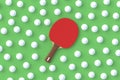 Ping pong paddle with balls on green background. Game for leisure. Sport equipment