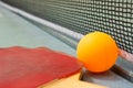 Ping pong paddles and ball on retro blue wooden background. Rackets ruined by time Royalty Free Stock Photo