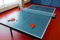 Ping pong rackets on game table with net, nobody