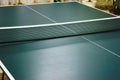 Ping pong table with net close-up. Green ping pong table close-up Royalty Free Stock Photo