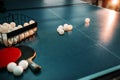 Ping pong table, rackets and basket with balls Royalty Free Stock Photo