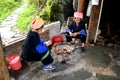 Two Minority ladies cooking at Ping'an Village, China