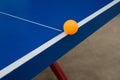 Pingpong ball hits the edge of a pingpong table Royalty Free Stock Photo