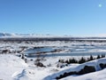 Pingvellir National Park Landscape Iceland. Water, mountains, snow and road.