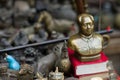 Pingyao, China - 08 13 2016: Vintage and old Chinese Bronze Great Leader Mao Zedong Bust Head small statue in a street market in P