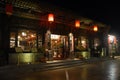 Pingyao in Shanxi Province, China: Street in Pingyao at night with a traditional restaurant and red lanterns Royalty Free Stock Photo