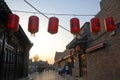 Pingyao in Shanxi Province China: Street scene in Pingyao ancient city at sunset with red lanterns Royalty Free Stock Photo