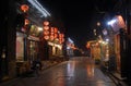 Pingyao in Shanxi Province, China: Street scene in Pingyao at night with city lights and red lanterns Royalty Free Stock Photo