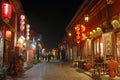 Pingyao in Shanxi Province China: Street scene in Pingyao at night with city lights and red lanterns