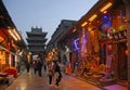 Pingyao in Shanxi Province China: Street scene in Pingyao at night with view of the Gushi Tower