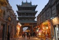 Pingyao in Shanxi Province China: Street scene in Pingyao at night with view of the Gushi Tower Royalty Free Stock Photo