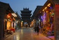 Pingyao in Shanxi Province China: Street scene in Pingyao at night with view of the Gushi Tower