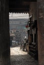 Pingyao in Shanxi Province, China: View through a doorway into an alley and courtyard with bicycles Royalty Free Stock Photo