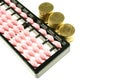 Pink abacus retro japan calculator and gold coins isolated Royalty Free Stock Photo