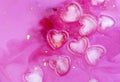 Pink abstract background of ice hearts. Love concept, modern style. Romantic card with frozen heart Royalty Free Stock Photo