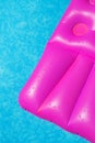 Pink air mattress in swimming pool. Holiday background. Royalty Free Stock Photo