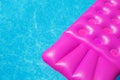 Pink air mattress in swimming pool. Holiday background. Royalty Free Stock Photo