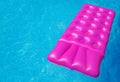 Pink air mattress in swimming pool. Holiday background. Royalty Free Stock Photo