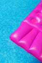 Pink air mattress in swimming pool. Holiday background. Royalty Free Stock Photo