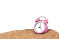 Pink alarm clock on the beach Royalty Free Stock Photo