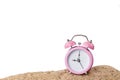 Pink alarm clock on the beach Royalty Free Stock Photo