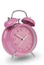 Pink alarm clock with the hands at 10 and 2 am or pm isolated on a white background