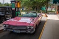 Pink american classic car on the gas station in Havana Cuba Royalty Free Stock Photo