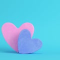 Pink anmd blue abstract heart shape on bright blue background in pastel colors