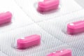 Pink Benadryl antihistamine tablets in blister pack