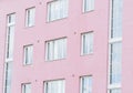 Pink apartment house wall with windows Royalty Free Stock Photo