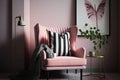 pink armchair with striped throw pillow and modern art print on the wall