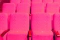 pink armchairs. Empty concert hall, theater chairs background ... color photo, empty cinema or concert hall. The red Royalty Free Stock Photo