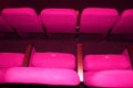 pink armchairs. Empty concert hall, theater chairs background ... color photo, empty cinema or concert hall. The red Royalty Free Stock Photo