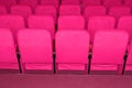 pink armchairs. Empty concert hall, theater chairs background ... color photo, empty cinema or concert hall. The red Royalty Free Stock Photo