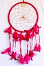 Pink ash crochet doily dream catcher close up on dark gray textu Royalty Free Stock Photo