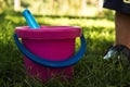 Pink baby bucket and blue shovel Royalty Free Stock Photo