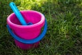 Pink baby bucket and blue shovel Royalty Free Stock Photo