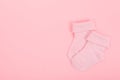 Pink baby girl socks on a pink background Royalty Free Stock Photo