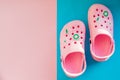 Pink baby sandals on a blue pink, rose background. Summer shoes. Copy space. Summer beach fashion. kids slippers Royalty Free Stock Photo