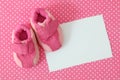 Pink baby shoes and blank note Royalty Free Stock Photo