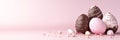 A pink backdrop with a banner displaying Easter-painted eggs inside a fractured chocolate eggshell Royalty Free Stock Photo
