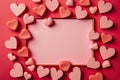 A pink background with an abundance of hearts and a copy space frame perfect for expressing love