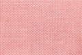 Pink background with braided checkered pattern, closeup. Texture of the weaving fabric, macro. Royalty Free Stock Photo