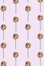 pink background of candy lollipop sweet with stick, delicious and fun food with colorful sugar. wallpaper, top view Royalty Free Stock Photo