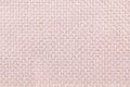 Pink background with checkered pattern, closeup. Structure of the fabric macro. Royalty Free Stock Photo