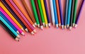 Pink background from color pencils, art supplies Royalty Free Stock Photo