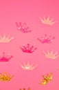 pink background with crowns Royalty Free Stock Photo
