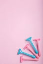 On a pink background are disposable women`s razors. View from above. Royalty Free Stock Photo