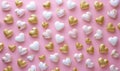 a pink background filled with golden and white coloured hearts