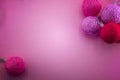 Pink background with garland of pink and red balls Royalty Free Stock Photo